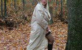 TAC Amateurs Out In The Rain 318883 Out In The Rain - Wearing Nothing But A Raincoat, Garter Belt And Stockings - Wet All Over
