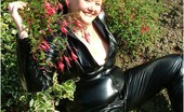 TAC Amateurs In The Flowers 318966 The Last In My Black Pvc Catsuit Series, And I Am Posing In Amongst The Flowers.
