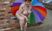 TAC Amateurs Brolly Fun 320211 Nood In A Garden With Just My Big Brolly To Hide Behind - Not That I Want To Hide.
