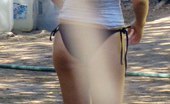 Upskirt Collection
 344621 Bikini thong hiding between booties