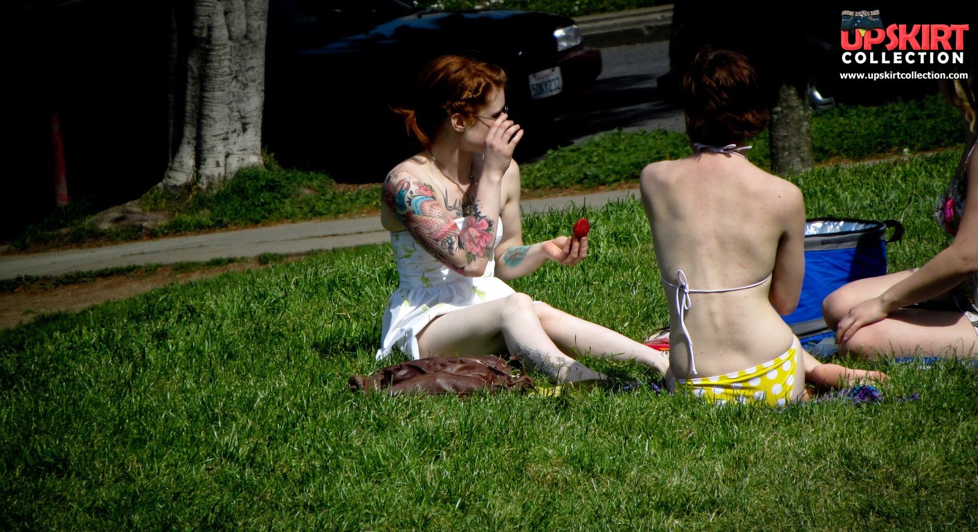 Upskirt Collection Tattooed redhead voyeured in a park image photo