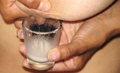 Lactalia 356534 Talia Fills A Shot Glass With Breast Milk
