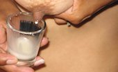 Lactalia 356534 Talia Fills A Shot Glass With Breast Milk
