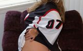 Wild Christy 416979 Young Football Player Christy Rubbing Her Fatty Pussy With A Large Dildo On Armchair
