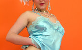 Pin-Up Wow 417786 Saucy Blonde Showgirl In Corset And White Fishnet Stockings Knows How To Tease.
