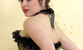 Pin-Up Wow 417815 Heavenly Brunette Model In Corset And Black Seamed Stockings Teases You.
