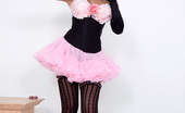 Pin-Up Wow 417834 Elle Richie In Her Tiny Pink Skirt And Black Corset Makes A Strip Only For You!
