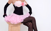 Pin-Up Wow 417834 Elle Richie In Her Tiny Pink Skirt And Black Corset Makes A Strip Only For You!
