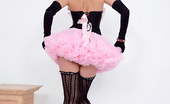 Pin-Up Wow 417834 Elle Richie In Her Tiny Pink Skirt And Black Corset Makes A Strip Only For You!
