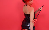 Pin-Up Wow 417964 Cute Brunette In Latex, Corset And Stockings, Shows Us Her Wicked Side.

