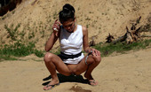 Pee Hunters 418502 Watch Brunette'S River Of Piss Flow Through Sand
