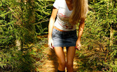 Pee Hunters Leggy Blonde Girl Empties Her Bladder Under A Tree
