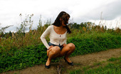 Pee Hunters 418621 Cute Brunette Babe Pisses Up A Storm In The Field
