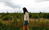 Pee Hunters 418621 Cute Brunette Babe Pisses Up A Storm In The Field
