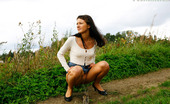 Pee Hunters 418621 Cute Brunette Babe Pisses Up A Storm In The Field
