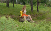 Pee Hunters Kinky Beauty Makes Piddle While Sitting On A Log
