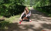 Hot Pissing 419685 Gal Pees In The Park Young Blondie With Long Hair Has A Piss In The Middle Of A Park Road
