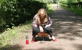 Hot Pissing 419685 Gal Pees In The Park Young Blondie With Long Hair Has A Piss In The Middle Of A Park Road

