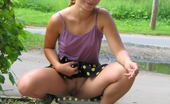 Hot Pissing 419727 Pissing And Smoking Jolly Smoking Chick Pulls Up Her Skirt And Does A Piss Near The Road
