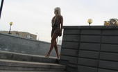 Hot Pissing 419739 Outdoor Stairs Piss Naked Blonde Beauty Makes A Puddle Of Pee Being Squatted On The Stairs
