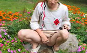 Hot Pissing 419744 Flowerbed Piddling Naughty Wench Squats In The Middle Of A Flowerbed And Makes A Pee-Pee
