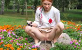 Hot Pissing 419744 Flowerbed Piddling Naughty Wench Squats In The Middle Of A Flowerbed And Makes A Pee-Pee
