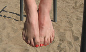Foot Factory Jenna 421818 05-20-2012 Cute Asian College Girl With Glasses Puts Feet In Sand
