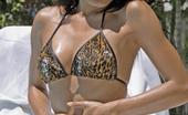 Erotic Asians 425617 Bronzed Asian Cutie Akemi Oiling Her Divine Body At The Poolside
