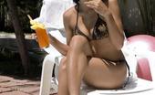 Erotic Asians 425617 Bronzed Asian Cutie Akemi Oiling Her Divine Body At The Poolside
