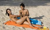 Erotic Asians 425650 Two Erotic Asian Girls Oiling Their Sexy Bodies On The Beach

