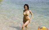 Erotic Asians 425666 Round Titted Asian Babe Mai Showing Her Assets On The Beach
