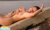 Cuties In Tights 427248 Girl Sunbathes At Nudist Beach In Sheer Pantyhose

