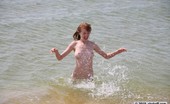 Skokoff 428043 Archi Naked Redhead Girl Playing In The Sea
