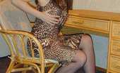 Nylon Passion 443177 Lady Demonstrating Her Treasures Lady In Leopard-Color Dress And Stockings Demonstrating Her Treasures
