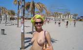X Nudism 453264 Blonde Nudist Kicks Up Some Water At A Nude Beach
