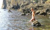 X Nudism 453269 Watch This Sexy Blonde Teen Lay In The Water Naked

