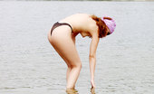 X Nudism 453546 Sexy Curvaceous Cutie Strips At A Nudist Beach
