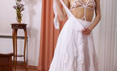 Met Art 463123 Met Art Pachli Divina A Sensually Removes Her White Long Dress, Revealing Her Smooth, Athletic Body Garbed In String Lingerie And Sheer Stockings That Amplified Her Erotic Looks. Divina A Peter Guzman Pachli
