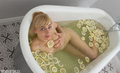 Amour Angels 466043 Amour Angels Lemon This Amazing Teen Blonde Gets Naked For Her Hot Bath With Lemons To Clean Her Irresistible Shapely Body For The Set.
