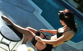 Pure Smoking 473854 Smoking Hot LegsKarlie Montana Smokes By Her Pool Adjusting Her Sheer Black Thigh Highs Pure Smoking
