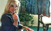 Pure Smoking 473886 Tasty Cigarettes1Blonde Bombshell Cory Lane Sits On Her Couch And Enjoys The Taste Of Her Cigarette Pure Smoking
