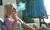 Pure Smoking 473886 Tasty Cigarettes1Blonde Bombshell Cory Lane Sits On Her Couch And Enjoys The Taste Of Her Cigarette Pure Smoking
