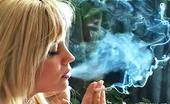 Pure Smoking 473886 Tasty Cigarettes1Blonde Bombshell Cory Lane Sits On Her Couch And Enjoys The Taste Of Her Cigarette Pure Smoking
