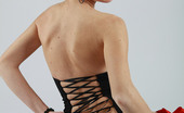 AV Erotica 475952 Sofi Redhead Babe Posing In Fancy Black Stockings And Corset AV Erotica
