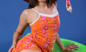 AV Erotica 476539 Liona Liona In Summer Dress And Red Hat Fondles Ass While Lying On Green Tube AV Erotica
