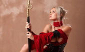 Sinful Goddesses 478954 Sexy Warrior In A Red Outfit Posing With The Golden Stick Sinful Goddesses

