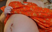 Preggo Katie Oiled Up Pregnant Belly Preggo Katie Slips Out Of Her Sexy Orange Dress And Rubs Oil All Over Her Belly And Breasts. Preggo Katie
