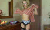 Lacy Nylons 493432 Gertrude Heated Blonde Admiring The Look Of Her Black Nylons And Animal Print Garter Lacy Nylons
