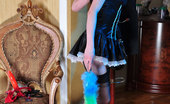 Lacy Nylons 493918 Beatrice Horny Black-Stockinged French Maid Matching A Garter To Her Red High Heels Lacy Nylons
