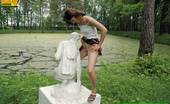 Pissing Outdoor 496084 Statue PissingHot Brunette Peeing In A Garden Of Statues Pissing Outdoor
